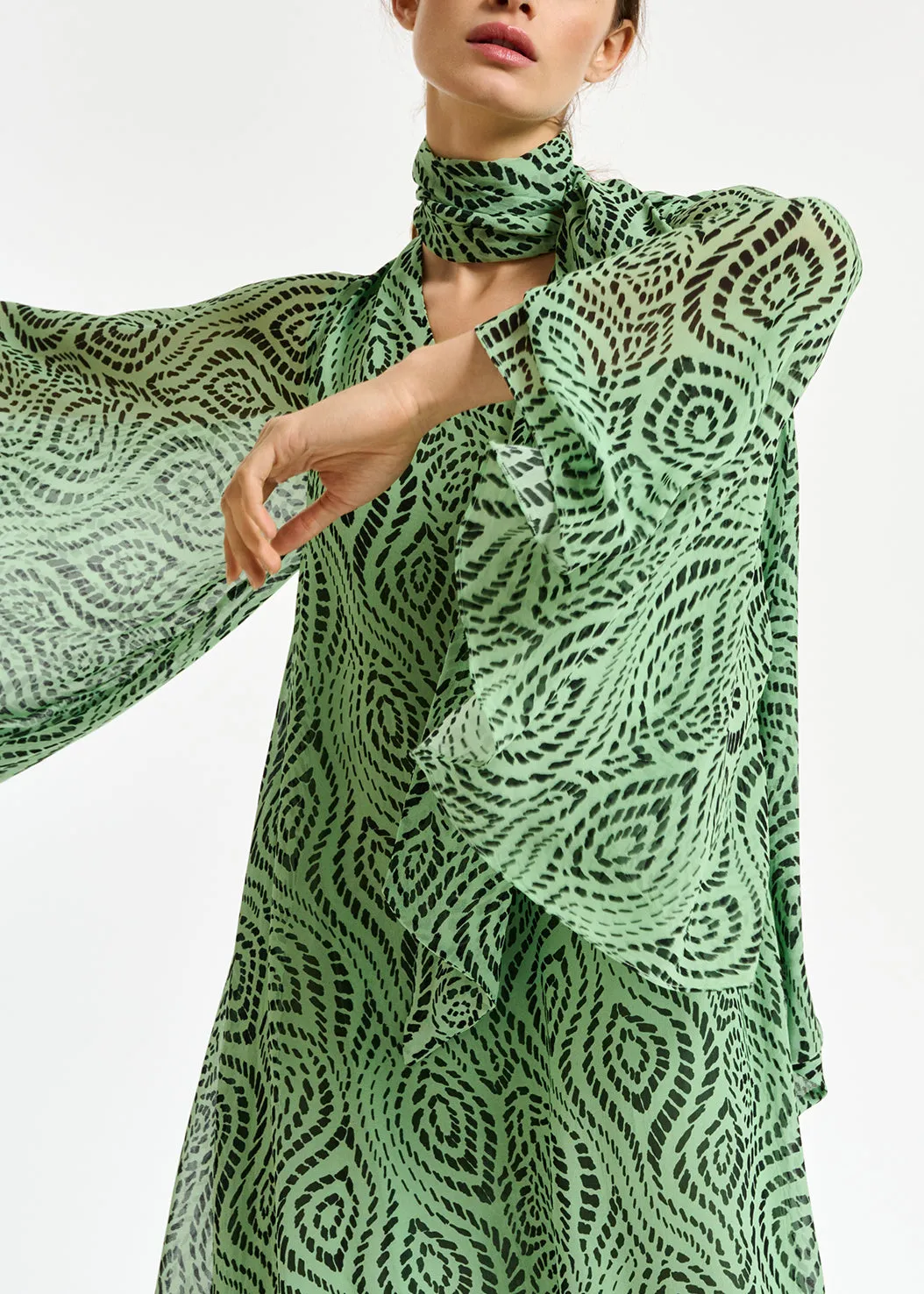 Mint green midi-length dress with geometric print