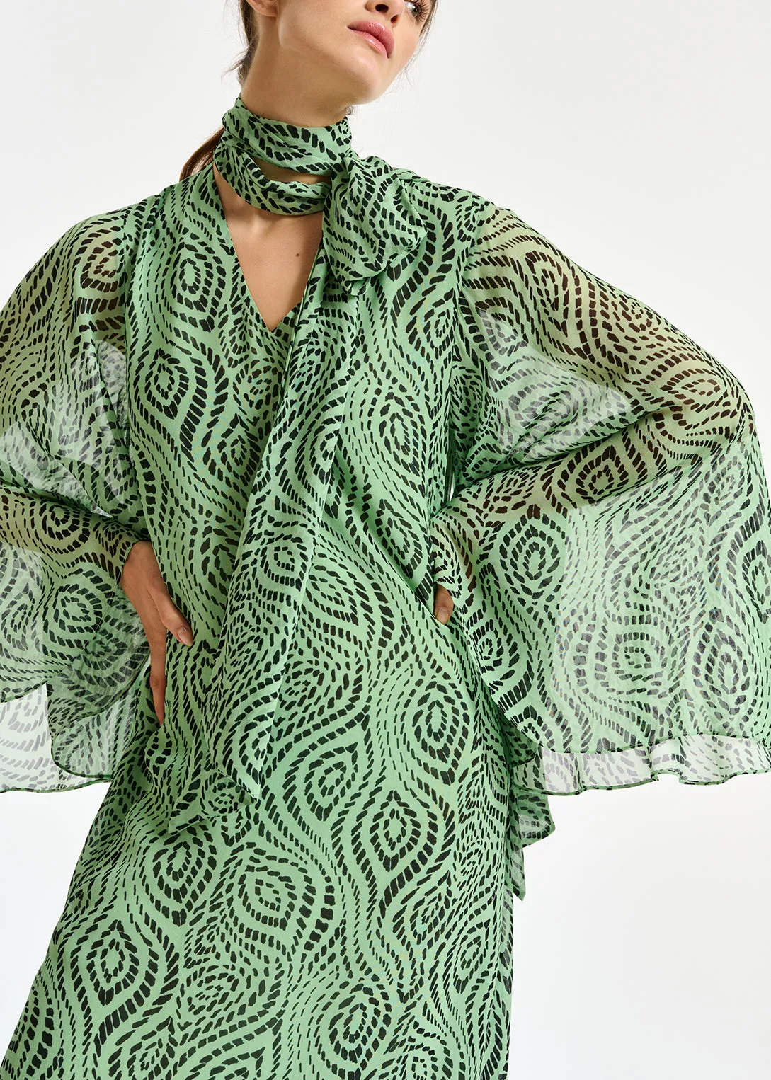 Mint green midi-length dress with geometric print