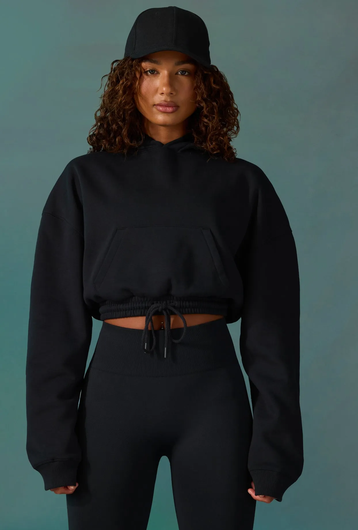 Progress - Cropped Drawstring Hooded Sweatshirt in Black